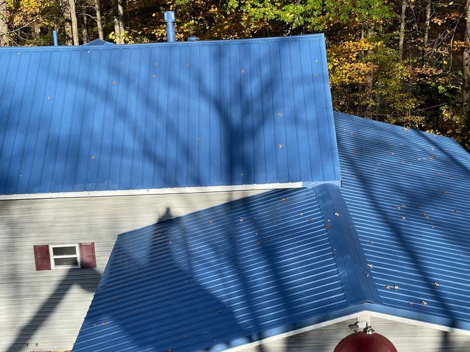 Metal roof after restoration by Roof Tech LLC showing complete transformation with protective coating